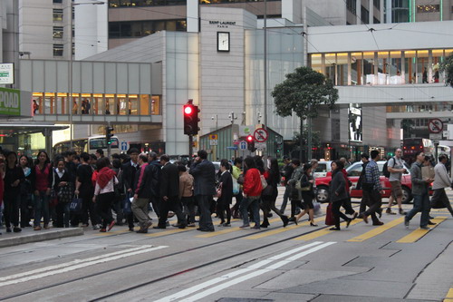 the pedestrians cross the street.